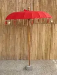 Bali umbrella, chinese red with metal coins and golden hearts hanging around the edge, ø 190 cm and 250cm height 
